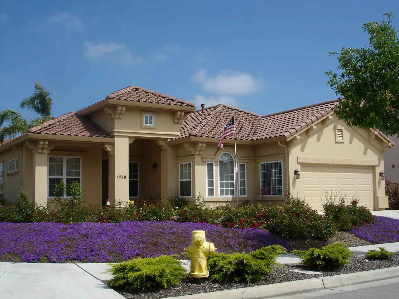 Ranch-style California home with tile roof and dry landscaping, typical of the homes around Lancaster, CA